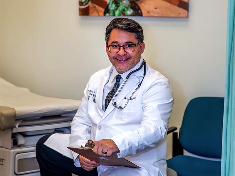 Dr. Douglas Tanita of Henderson Women's Care working in patient room