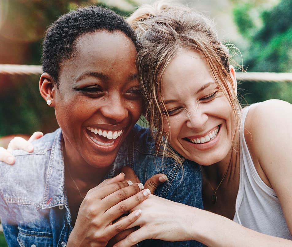 Two women laughing together